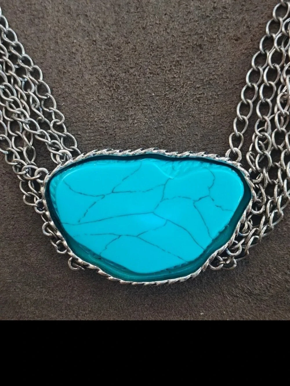Silver Tone Multi Strand Chain Statement Necklace With a Faux Turquoise Stone